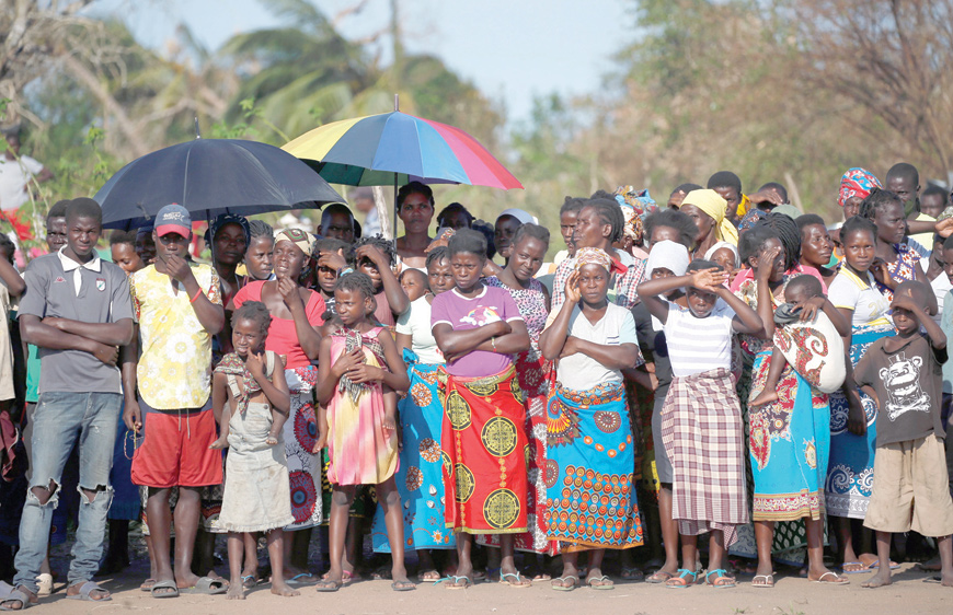 People look on as they wait for food aid in the aftermath of Cyclone Idai in Guara Guara village, near Beira, Mozambique, on Tuesday (Reuters photo)