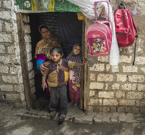 Egyptian mother Aaz Menhom (left) and her daughter Nada (right) 6, and son Atef  5, stand outside their home in the village of Al Jendaya, in the Bani Mazar province, in the Minya governorate, some 200km south of Cairo, on April 5 (AFP photo)