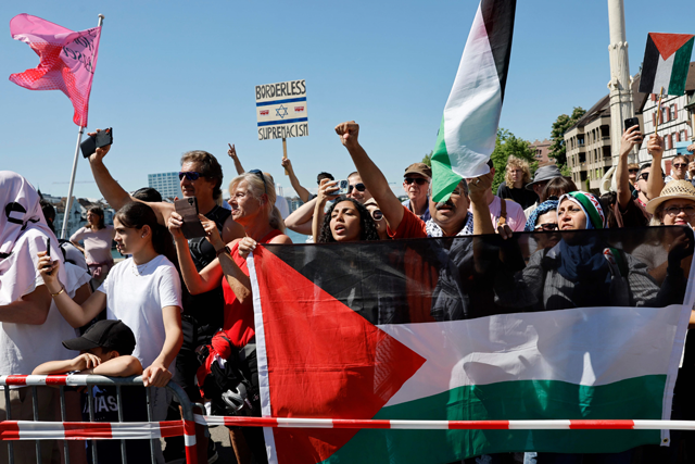 Protestors hold Palestinian flags and signs as they attend a demonstration against Israel's participation during the Eurovision Song Contest 2025 opening ceremony in Basel on Sunday (AFP photo)