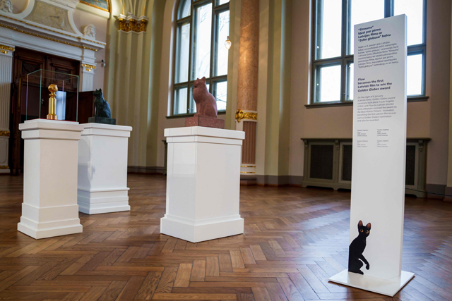 The Golden Globe award (left) for the animated movie ‘Flow’ directed by Latvian film director Gints Zilbalodis is on display at the Latvian National Museum of Art in Riga, Latvia, on January 30 (AFP photo)
