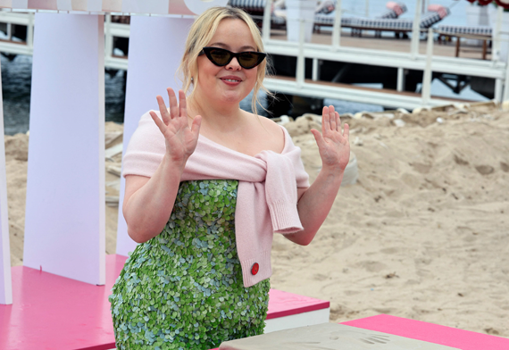 Irish actress Nicola Coughlan makes a handprint during the 8th edition of the Cannes International Series Festival (Canneseries) in Cannes, southern France, on Monday (AFP photo)