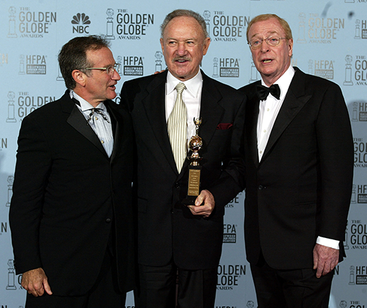 US actor Gene Hackman (centre) is accompanied by fellow actors Robin Williams (left) and Michael Caine  after he was honoured with the Cecile B. DeMille Award at the 60th Annual Golden Globe Awards, 19 January 2003, in Beverly Hills, CA (AFP photo)