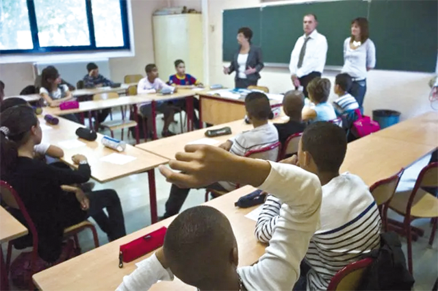 One hundred eighty collèges  in France are trialing a mobile phone ban for pupils (AFP photo)