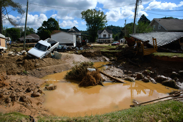 Damage and residual flooding from Mill Creek is seen in the aftermath of Hurricane Helene on September 29 (AFP photo)