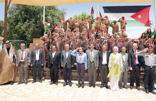 HRH Princess Basma poses for a group photo during an event organised by the Ministry of Education’s Directorate of Boy Scouts and Girl Guides, on the occasion of Independence Day on Thursday (Petra photo)