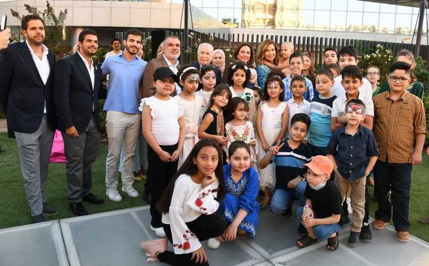 HRH Princess Ghida Talal poses for a group photo during the inauguration of the ‘Hassan and Yusra Kolaghasi Garden’ at the King Hussein Cancer Centre on Monday  (Petra photo)