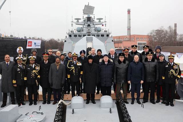 This handout photograph taken on Monday shows India's defence minister Rajnath Singh (centre) posing for photographs with the Russian delegation during the commissioning ceremony of India's latest multi-role stealth guided missile frigate INS Tushil, in the Baltic port of Kaliningrad (AFP photo)