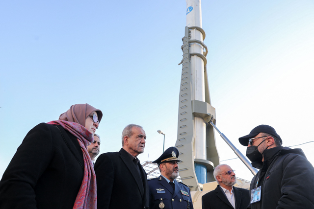 In this handout photo provided by the Iranian presidency on Sunday, President Masoud Pezeshkian (centre) visits a defence and space achievements exhibition in Tehran (AFP photo)