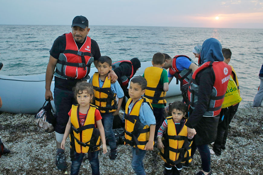 Syrian migrants arrive by dinghy from the Turkish coast, at Mytilene’s beach on the northeastern Greek island of Lesbos, on June 18 (AP photo)
