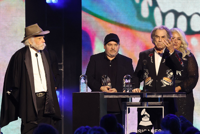 Grateful Dead members Bob Weir (left) and Mickey Hart (second right) with Justin Kreutzmann (second left), son of Bill Kreutzmann, and Trixie Garcia (right), daughter of Jerry Garcia, hold the 2025 Persons of the Year awards during the 2025 MusiCares Person of the Year benefit gala at the Los Angeles Convention Centre in Los Angeles on Friday (AFP photo)