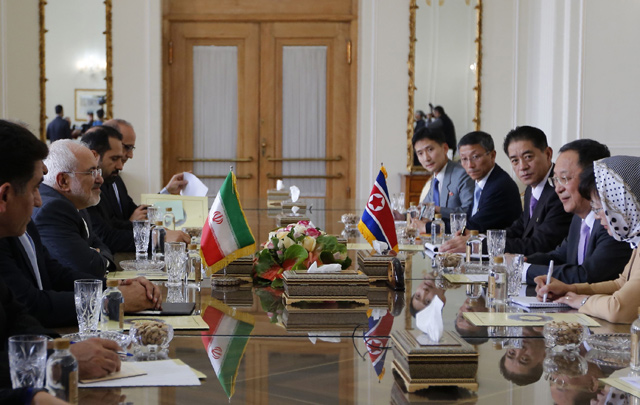 Iran's Foreign Minister Mohammad Javad Zarif (second left) talks to North Korea's Foreign Minister Ri Yong-ho (second right) during their meeting in the capital Tehran on Tuesday (AFP photo)
