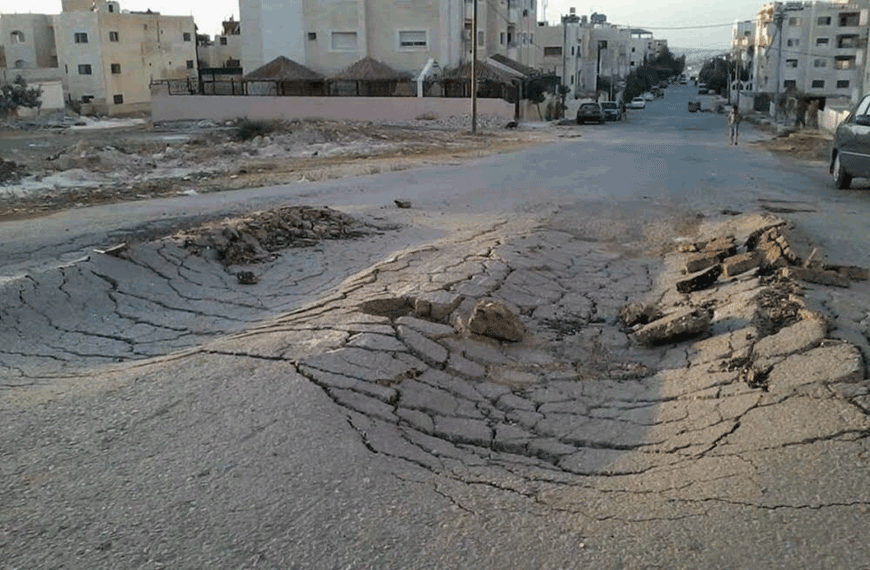 A view of a damaged road in Jordan following rain in December 2022 (Al Rai photo)