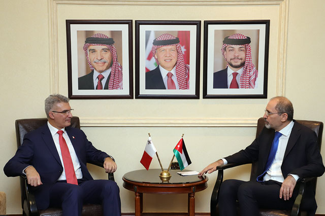 Foreign Minister Ayman Safadi meets with his Maltese counterpart Carmelo Abela in Amman on Sunday (Petra photo)