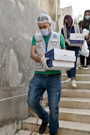 Tkiyet Um Ali staff members are seen distributing food parcels to needy households in this recent photo (Photo by Claudia Lacave)