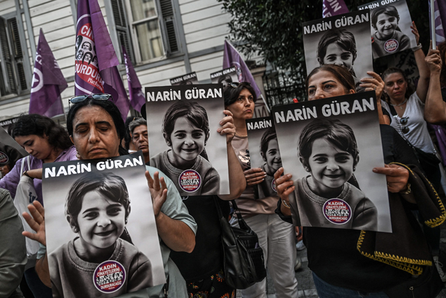 Protesters hold portraits of eight-year-old Narin Guran, whose body was found after being missing for 19 days, during a protest at Kadikoy district in Istanbul, on Sunday (AFP photo)