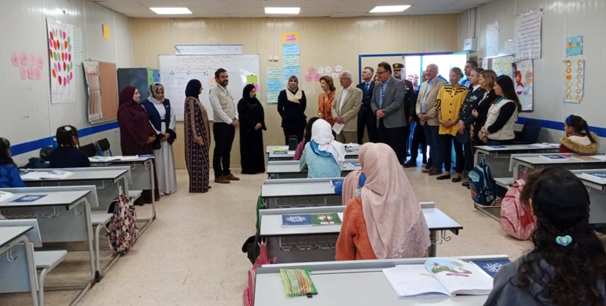 King Carl XVI Gustaf and Queen Silvia of Sweden, accompanied by Princess Rym Ali, the escort of honour, visit a school in the Zaatari camp for Syrian refugees on Thursday (Petra photo)
