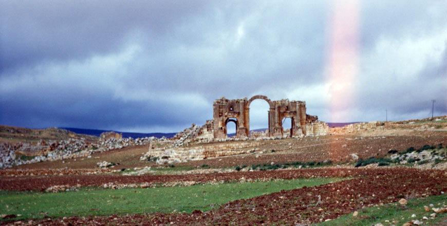 A photograph from the American Centre of Oriental Research’s George Bass collection of Hadrian’s Arch, South Gate, in Jerash, Jordan, in 1955 before development (Photo courtesy of ACOR)