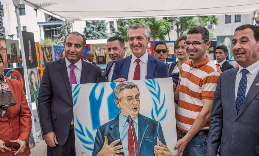 United Nations High Commissioner for Refugees Filippo Grandi (centre) poses for a photo at  the #WithRefugees Summer Bazaar at the Greater Amman Municipality with Amman Mayor Yousef Shawarbeh (far left) on Thursday  (Photo courtesy of UNHCR)