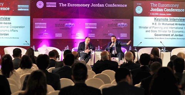 Minister of Planning and International Cooperation and State Minister for Economic Affairs Mohamad Al-Ississ and consulting editor and moderator Richard Banks (left) at the Euromoney conference in Amman on Tuesday (Photo courtesy of the Planning Ministry’s Facebook)