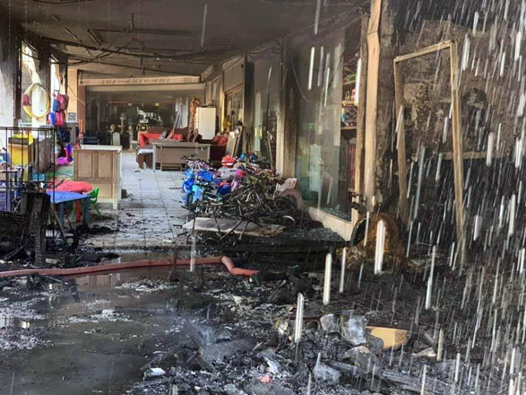 The charred remnants of shops after a fire at a commercial complex in Dahiyet Al Rawda, Amman, on Friday (Photo by Osama Aqarbeh)