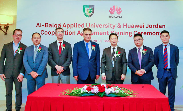 Representatives from Balqaa Applied University and Huawei Jordan pose for a photo during a signing ceremony in Shenzhen, China (Petra photo)