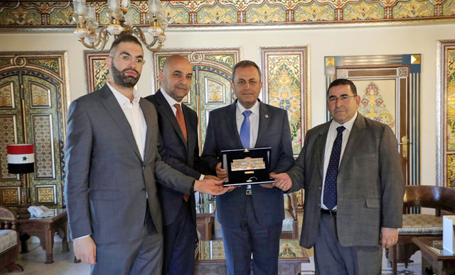 Syrian Chargé d’Affaires in Amman Ayman Alloush (centre) poses for a photo alongside deputies Qais Ziadin (far left), Tareq Khouri (second from left) and Nidal Taani (right) on Sunday (Petra Photo)