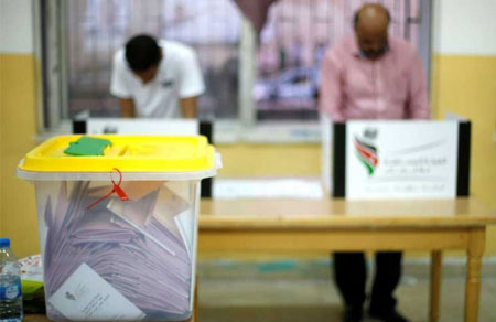 Ballots sit in a container as members of the the Jordan Teachers Association cast their votes on Saturday (Petra photo)