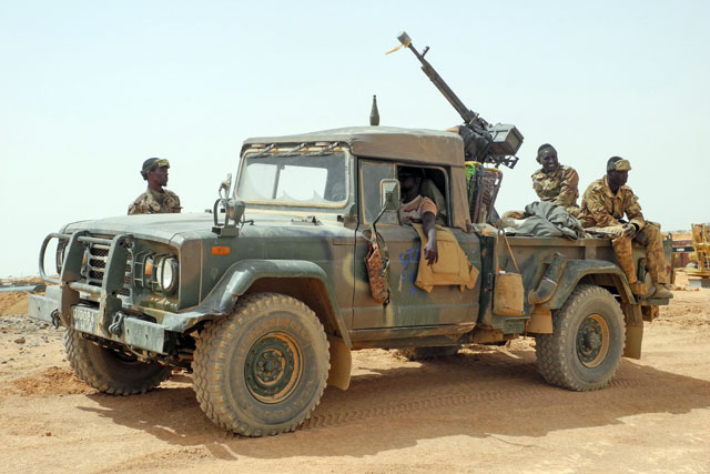 Members of the Malian army patrol in Anderamboukane, in the Menaka region, on Friday. Foreign Minister Ayman Safadi issued a Tweet on Sunday condemning the terrorist attack on a Fulani village in central Mali (AFP photo)