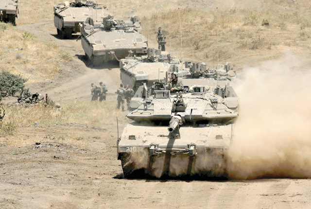 A photo shows an Israel military drill near Kibbutz Merom Golan in the Israeli-occupied Golan Heights on Wednesday (AFP photo)