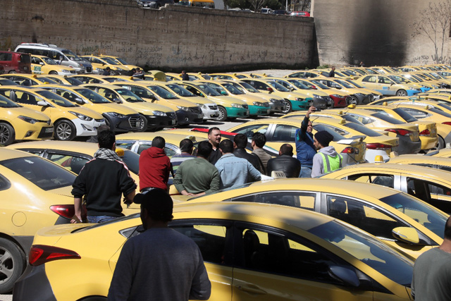 Taxi drivers hold a sit-in near the Lower House, on Tuesday  (Photo by Osama Aqarbeh)