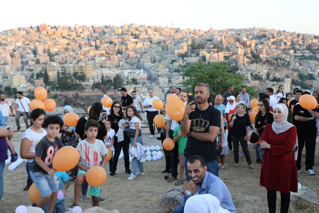   Participants of a ceremony marking World Population Day prepare to release balloons at the Amman Citadel on Sunday  (Photo courtesy of UNFPA)
