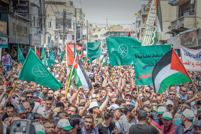 Demonstrators march in Downtown Amman to protest against Israeli measures in occupied Jerusalem on Friday (Photos by Amjad Ghsoun)