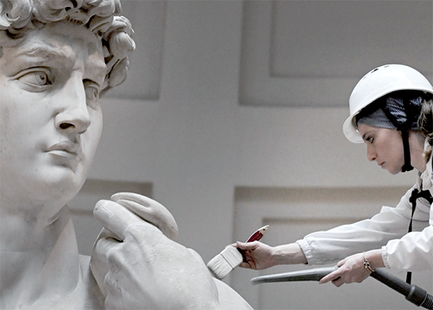 Italian restorer Eleonora Pucci cleans Michelangelo’s statue of David using a backpack vacuum and synthetic fibre brush at the Galleria dell’Accademia, in Florence on Monday (AFP photo)