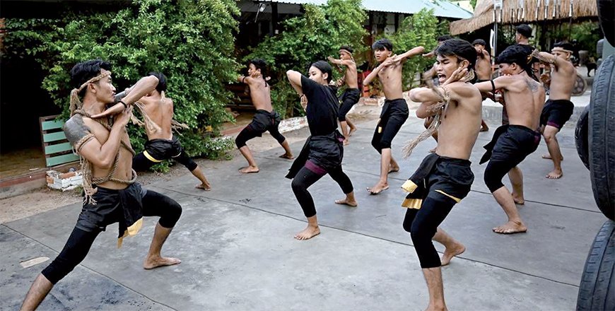 This photo taken on May 25 shows ancient Khmer martial art Yutkromkhorm practitioner Kim Bonneat (left) training with his colleagues at a club in Krong Areyksat (AFP photo)