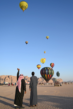 Viewers watch launch of hot air balloons in Wadi Rum on Friday morning (Photo by Amjad Ghsoun)