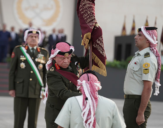 His Majesty King Abdullah, the Supreme Commander of the Jordan Armed Forces-Arab Army, accompanied by HRH Crown Prince Hussein, attends a ceremony held by JAF to present the King’s Colours and the Great Arab Revolt Flag to army units on Monday (Photo courtesy of Royal Court)