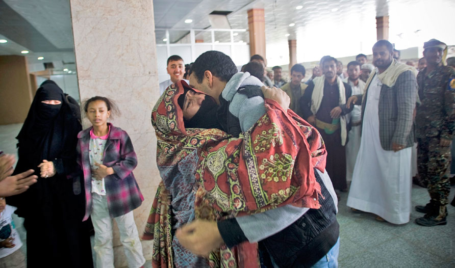 A Yemeni man hugs his mother, who was stranded in Egypt after conflict broke out in Yemen, after arriving at Sanaa International Airport in Yemen on Wednesday (AP photo by Hani Mohammed)
