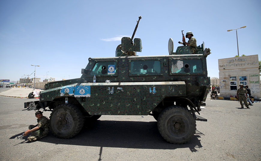 Soldiers sit on a police personnel carrier stationed during celebrations marking the 25th anniversary of Yemen’s unification in Sanaa on Saturday (Reuters photo by Mohamed Al Sayaghi)