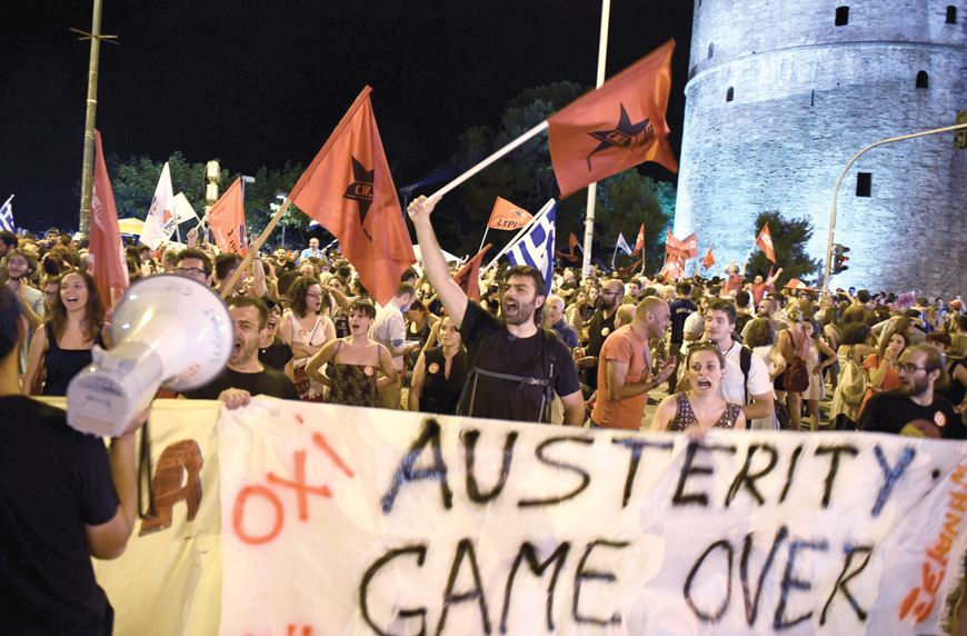 Supporters of the ‘no’ vote celebrate after the results of the referendum in the northern Greek port city of Thessaloniki, Sunday (AP photo)