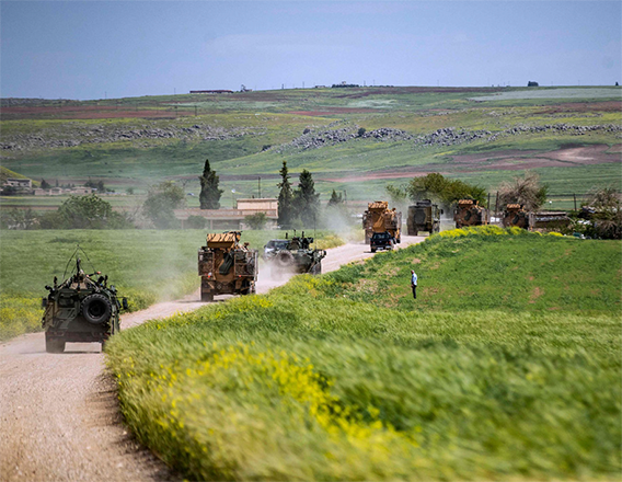 Turkish and Russian military vehicles patrol in the countryside of Rumaylan (Rmeilan) in Syria's northeastern Hasakeh province bordering Turkey, on Thursday (AFP photo)