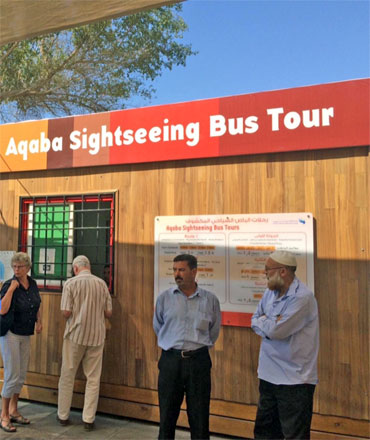 European tourists are seen buying tickets for an Aqaba Sightseeing Bus Tour, on Tuesday (Photo courtesy of Khalil M. Farrayeh)