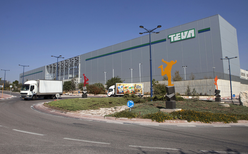 Trucks run past Teva Pharmaceutical Logistic Centre in the town of Shoam, Israel (AP file photo)