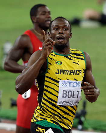Jamaica’s Usain Bolt celebrates after winning the gold in the men’s 200m final at the World Athletics Championships at the Bird’s Nest Stadium in Beijing on Thursday (AP photo)