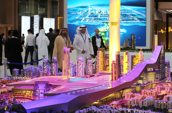 People visit the model of Meydan One, a 25 billion dirhams, $6.8b development at Cityscape Global exhibition, Tuesday, in Dubai, United Arab Emirates (AP photo)