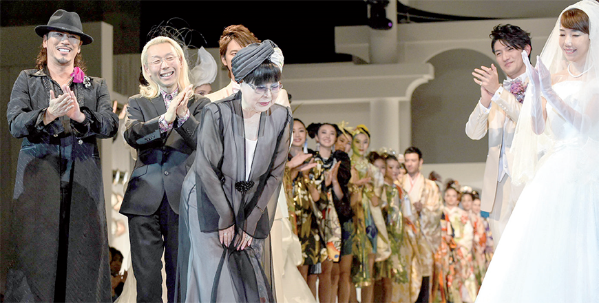 This file photo taken on February 25, 2015 shows Japanese fashion designer Yumi Katsura (centre) thanking guests during the finale of the 2015 Yumi Katsura Grand Collection in Tokyo (AFP photo)