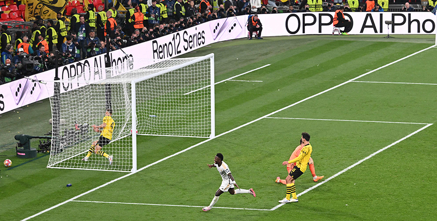Real Madrid's Brazilian forward #07 Vinicius Junior scores his team's second goal past Dortmund's Swiss goalkeeper #01 Gregor Kobel during the UEFA Champions League final football match between Borussia Dortmund and Real Madrid, at Wembley Stadium, in London, on Saturday (AFP photo)