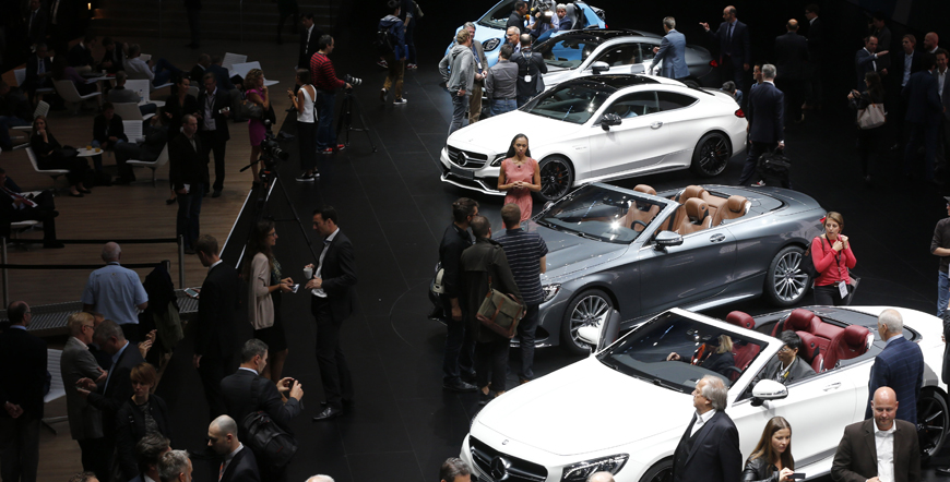 Visitors surround cars in the Mercedes hall on the first press day of the IAA Frankfurt Auto Show in Germany on Tuesday (AP photo)