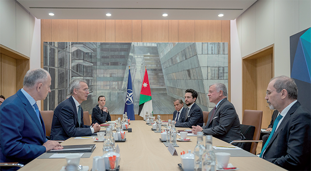 His Majesty King Abdullah on Monday at a meeting in Brussels, attended by HRH Crown Prince Hussein, with NATO Secretary General Jens Stoltenberg and members of the North Atlantic Council (Photo courtesy of the Royal Court)