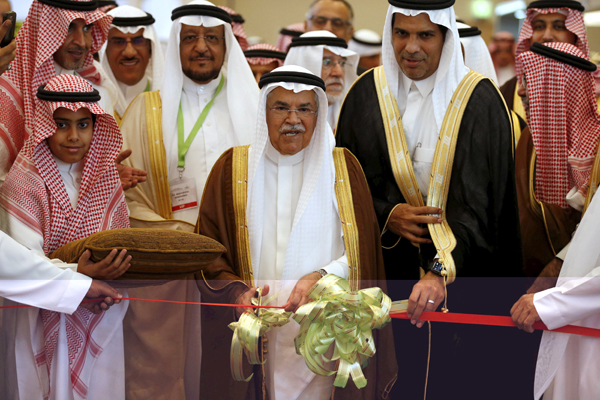 Saudi Arabia's Oil Minister Ali Al Naimi cuts the ribbon during the opening ceremony of Mining & Minerals Exhibition & Conference in Riyadh on Tuesday (Reuters photo)