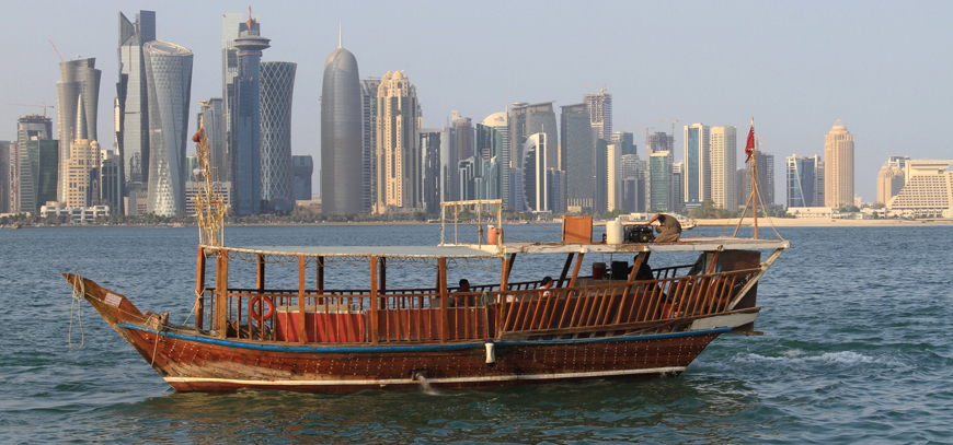 People travel in a traditional boat at Doha Corniche, Qatar, on Saturday (Reuters photo)